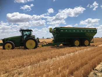 Grain Cart Working in the field at wheat harvest